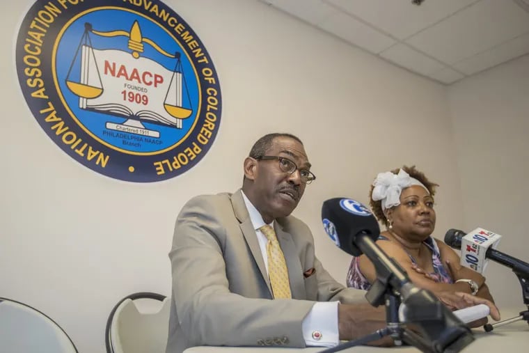 Rodney Muhammad, left, president of the NAACP Philadelphia Branch, and Rochelle Bilal, secretary of the Philadelphia NAACP, right, hold a news conference urging judges not to appoint Lynne Abraham as interim District Attorney.