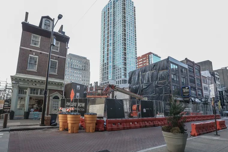 A vacant lot now sits where buildings once stood along Jewelers' Row in Philadelphia. A Toll Brothers subsidiary is seeking to build a 24-story glass tower on the lot.