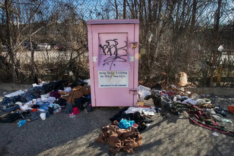 Pink donation bin at 21st and Erie in north Philadelphia as seen on Wednesday morning February 11, 2015. The donations are scattered all over the sidewalk outside this bin. (ALEJANDRO A. ALVAREZ / Staff Photographer)