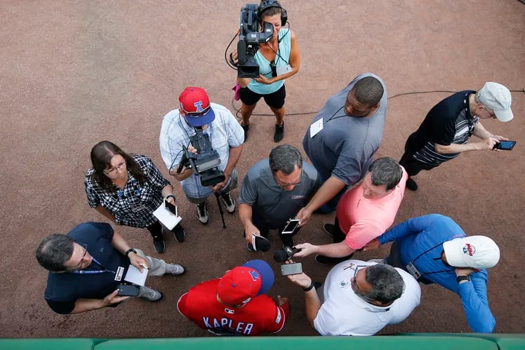 Phillies manager Gabe Kapler (bottom), here meeting with the media earlier in spring training, vows to be more candid in his second season.
