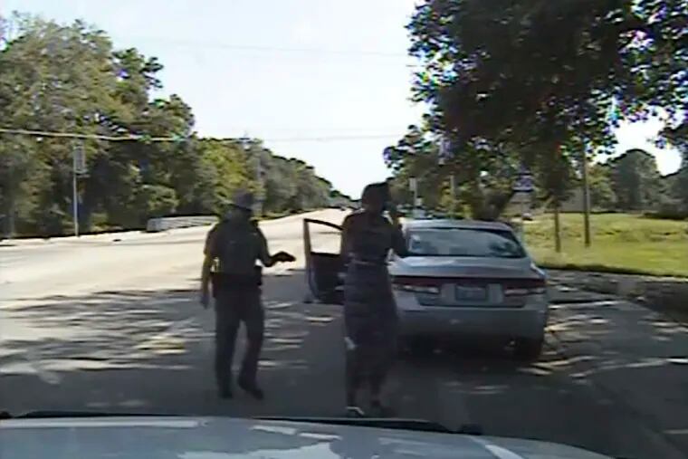 FILE - In this July 10, 2015, file frame from dashcam video provided by the Texas Department of Public Safety, Trooper Brian Encinia arrests Sandra Bland after she became combative during a routine traffic stop in Waller County, Texas. Texas authorities faced sharp questioning over why cell phone video Sandra Bland took during her confrontational 2015 traffic stop never publicly surfaced until May 2019. (Texas Department of Public Safety via AP, File)