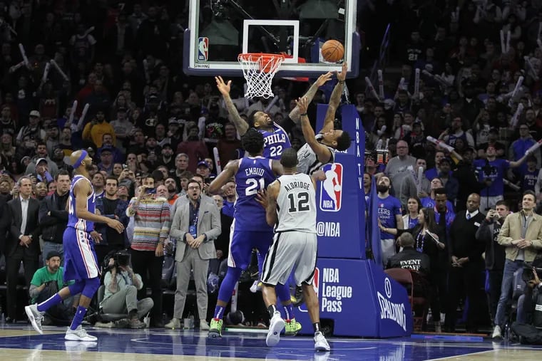 Wilson Chandler, center #22, of the Sixers goes up to block a shot by DeMarco DeRozan of the Spurs at the end of the game on Jan. 23, 2019.