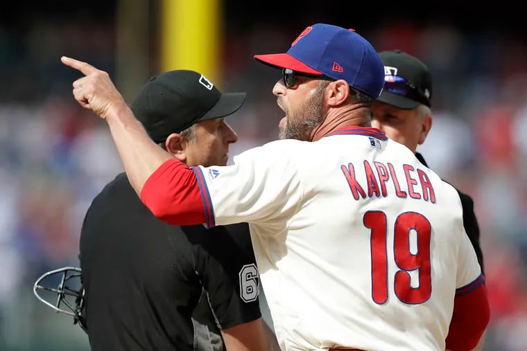 Gabe Kapler argues with the umpires after his ejection on Saturday.