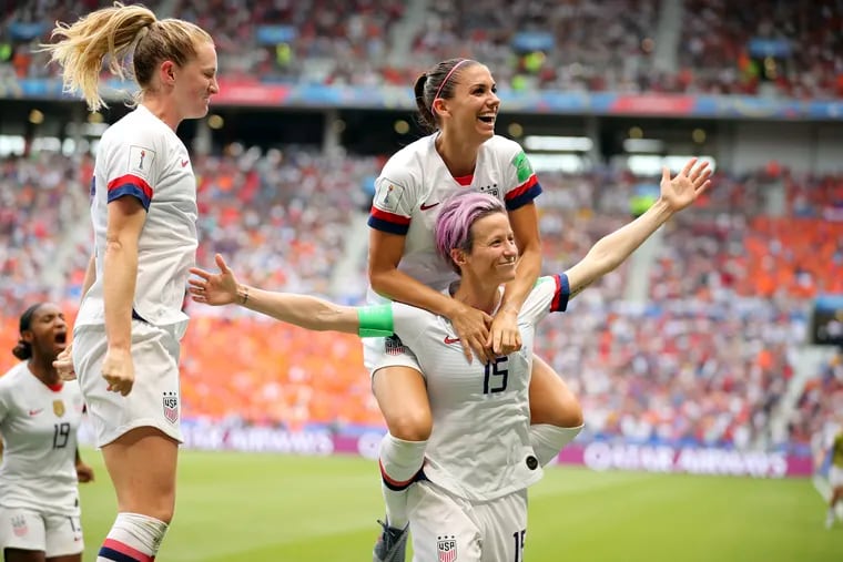 Megan Rapinoe celebrates with (from left to right) Crystal Dunn, Samantha Mewis and Alex Morgan after scoring the United States' first goal in the Women's World Cup final against the Netherlands.
