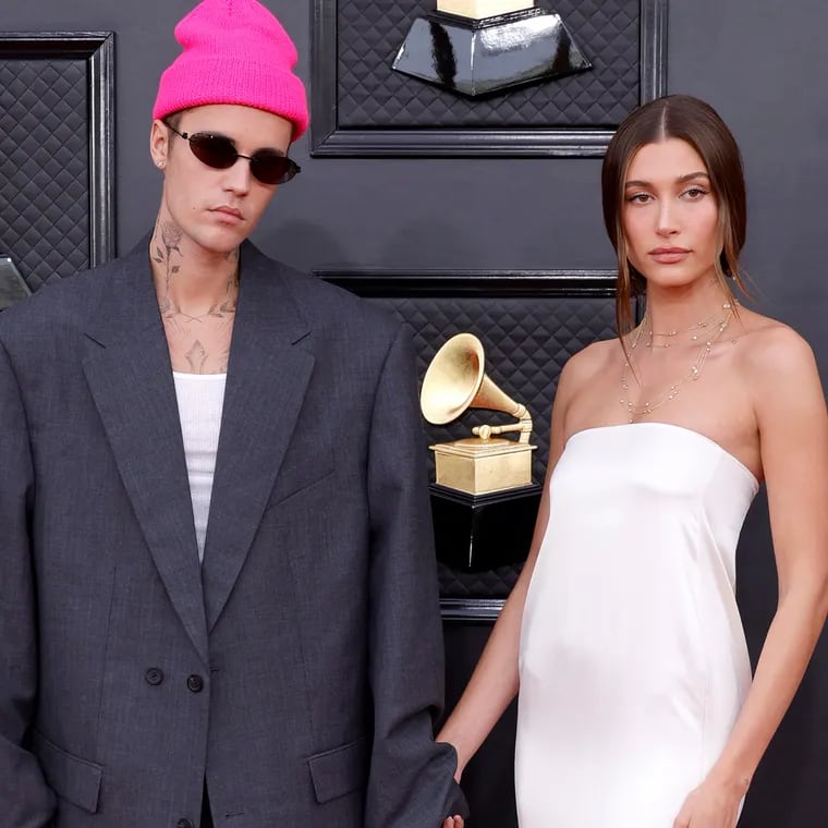 Justin Bieber, left, and Hailey Bieber attend the 64th Annual Grammy Awards in 2022.