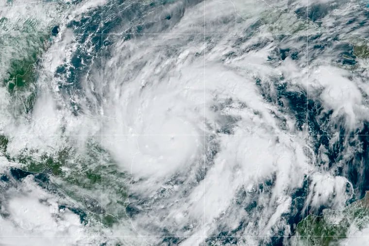 This GeoColor satellite image taken Monday at 1 p.m. EDT, and provided by NOAA shows Hurricane Eta in the Gulf of Mexico approaching the border of Honduras and Nicaragua.