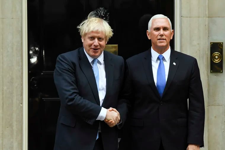 Britain's Prime Minister Boris Johnson (left) greets U.S. Vice President Mike Pence on the doorstep of 10 Downing Street, in London, Thursday, Sept. 5, 2019.