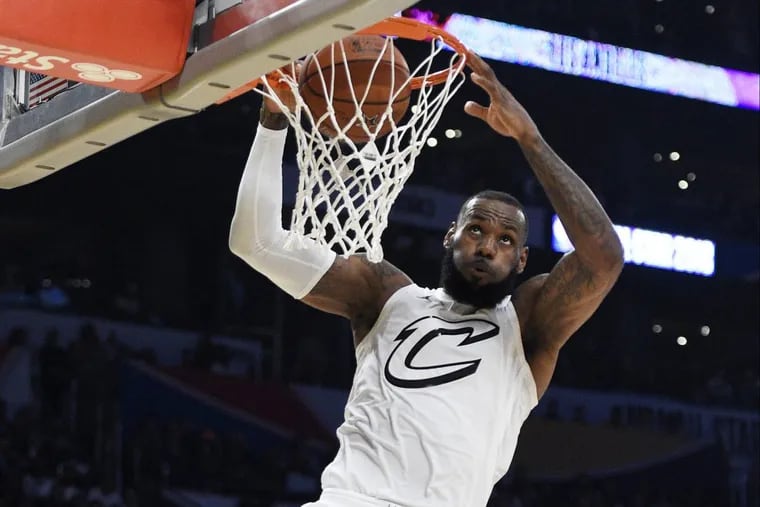 LeBron James goes up for a dunk during the NBA All-Star Game on Sunday.