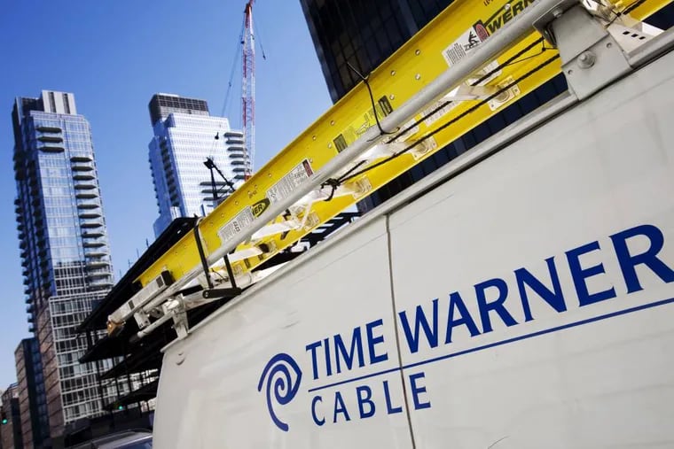 FILE - In this Feb. 2, 2009 file photo, a Time Warner Cable truck is parked in New York. Comcast has agreed to buy Time Warner Cable for $45.2 billion in stock, or $158.82 per share, in a deal that would combine the top two cable TV companies in the nation, according to a person familiar with the matter who spoke on condition of anonymity because it had not been announced formally. An announcement is set for Thursday morning, Feb. 13, 2014, the person said. (AP Photo/Mark Lennihan, File)
