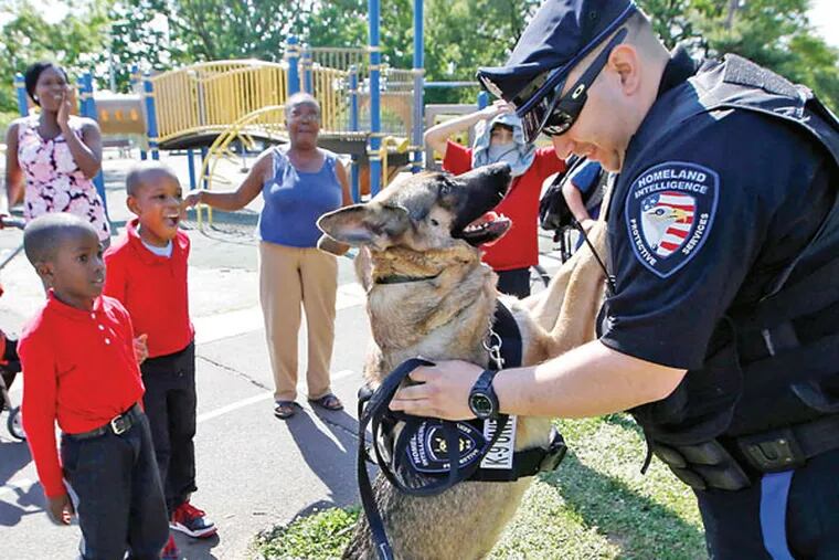 Chris Rodriguez’s dog, Misha, is always on the lookout for crime and a cheek to plant some kisses on. (YONG KIM / STAFF PHOTOGRAPHER)