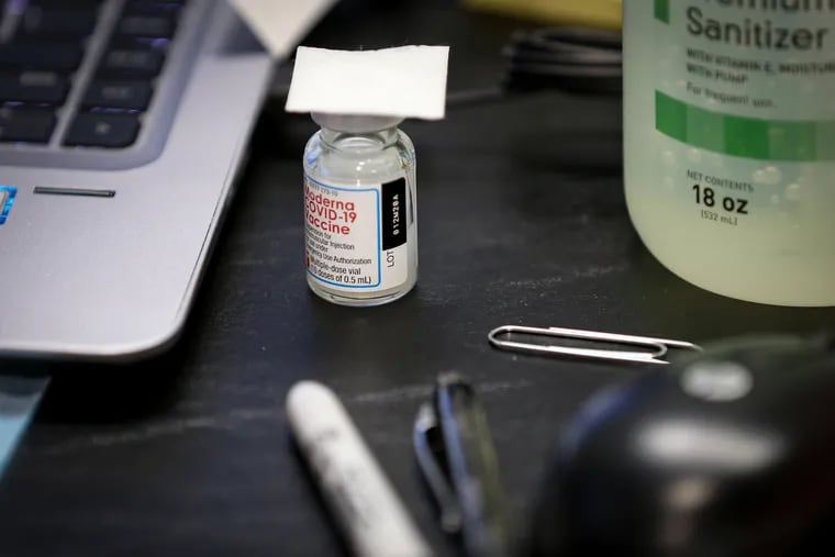 A vial of the Moderna COVID-19 vaccine sits ready for use at the Main Line Health vaccination clinic inside the African Episcopal Church of St. Thomas in Philadelphia on Feb. 10, 2021.