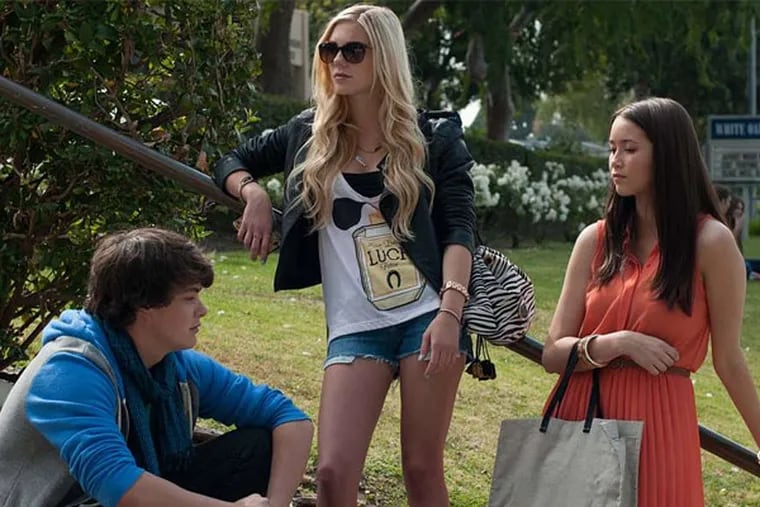 Israel Broussard, Claire Vivien (center), and Katie Chang as the Bling Ring bandits. Victim Paris Hilton actually let filmmakers use her home to make the movie.