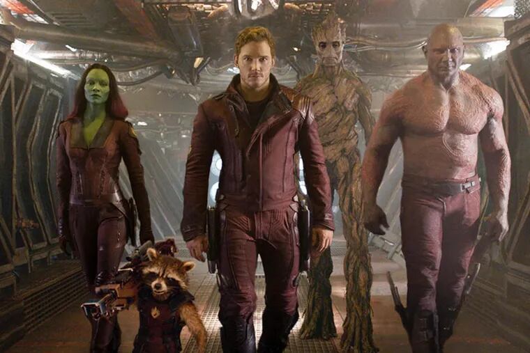 CORRECTS SPELLING OF NAME TO BRADLEY COOPER - This image released by Disney - Marvel shows, from left, Zoe Saldana, the character Rocket Racoon, voiced by Bradley Cooper, Chris Pratt, the character Groot, voiced by Vin Diesel and Dave Bautista in a scene from "Guardians Of The Galaxy." (AP Photo/Disney - Marvel)