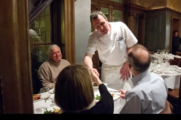 Chef Pierre Calmels visiting with guests dining at Le Cheri in 2014.