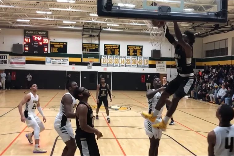 Neumann-Goretti senior Chris Ings dunks 2 of his 31 points in Friday night’s win against Archbishop Wood.