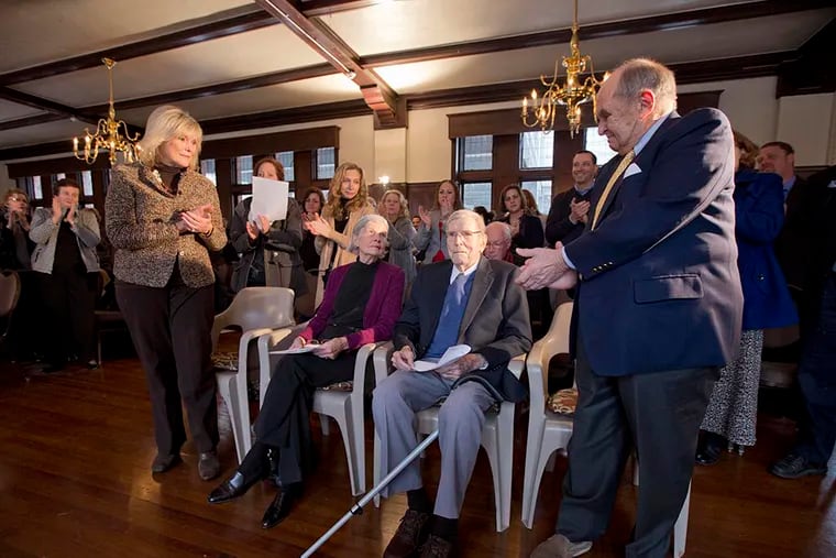 The headmaster's wife, Alice McGee, and Gil Gehin Scott (right) lead a standing ovation after it is announced that Henry and Eleanor Rowan will donate $17 million to Doane Academy in Burlington City, N.J. ( DAVID SWANSON / Staff Photographer )