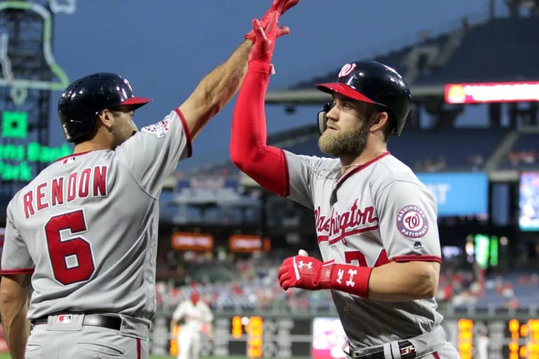 Bryce Harper, right, of the Nationals is congratulated by Anthony Rendon after his 2-run home run at Citizens Bank Park in September.