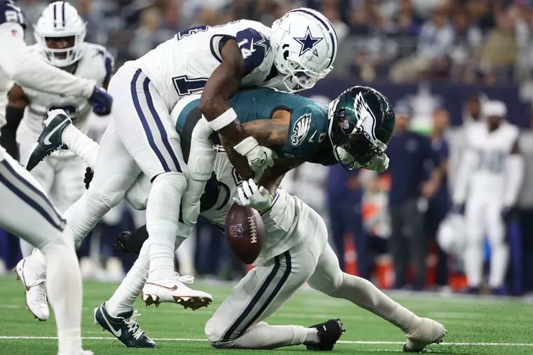 Dallas Cowboys safety Markquese Bell knocks the ball aways from Philadelphia Eagles wide receiver DeVonta Smith during the fourth quarter at AT&T Stadium on Sunday, Dec. 10, 2023, in Arlington, TX. Dallas recovers the ball.