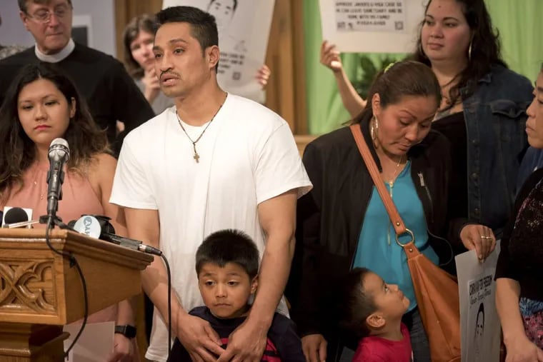 June 5, 2017 — Javier Flores Garcia speaks with son Yael, 3, his wife Alma, son Javier Jr., 5, and supporters at the Arch Street United Methodist Church in Philadelphia where the 40-year-old Mexican man has taken refuge.