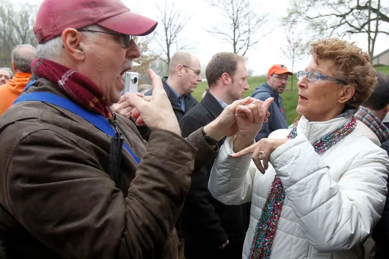 (left), communicates with Carol Finkle, a deaf-rights advocate, during the rally in support of Valley View in Media. AKIRA SUWA / Staff Photographer