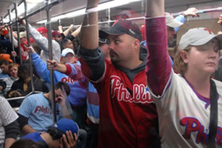 Exhausted fans squeezed back onto packed subway trains after the parade on Broad Street yesterday.