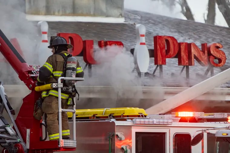 Pub and Pins signage at the multi-alarm fire at Levittown Lanes in Levittown, PA on Wednesday March 30, 2022. This multi-alarm fire destroyed this bowling alley.