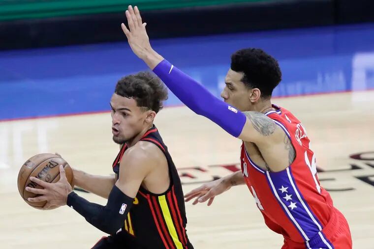 Hawks guard Trae Young drives with the ball against Sixers forward Danny Green in Game 1.