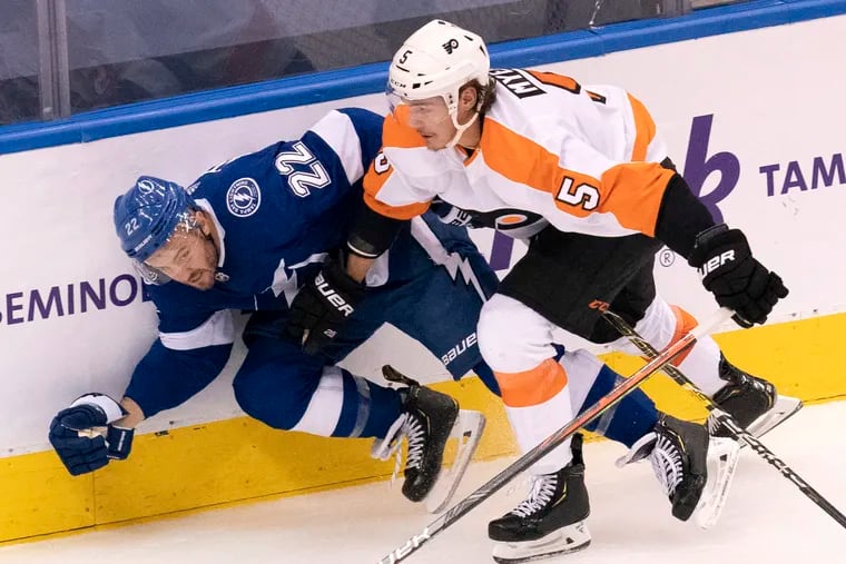 The Flyers need defenseman Phil Myers (5), shown checking Tampa Bay Lightning defenseman Kevin Shattenkirk (22) into the boards during the round-robin tournament in August, to regain the form he showed last season.