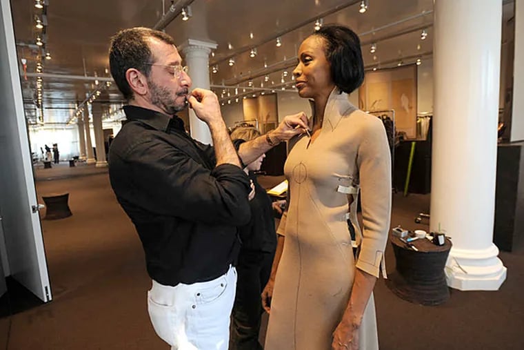Ralph Rucci fitting model Coco Mitchell in 2008. He was among the first designers to use an African American as a fit model. (Jennifer S. Altman)
