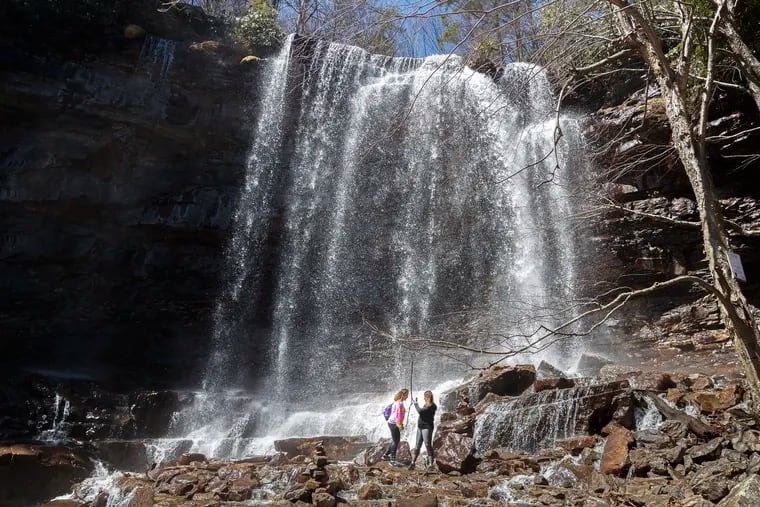 Two hikers stopped to capture the grandeur of the middle falls on the Glen Onoko Falls Trail in Jim Thorpe in April 2019, just weeks before the Pennsylvania Game Commission closed the main trail for safety reasons. Nearly a dozen fatalities, along with numerous injuries, have been reported there over the last half-century.