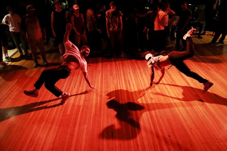 Joshua Verwey, left, and Christian Walker dance during The Gathering, a monthly hip-hop dance party, at The Rotunda in West Philadelphia on Thursday, May 30, 2019. The event, which regularly draws breakers, began in 1996.
