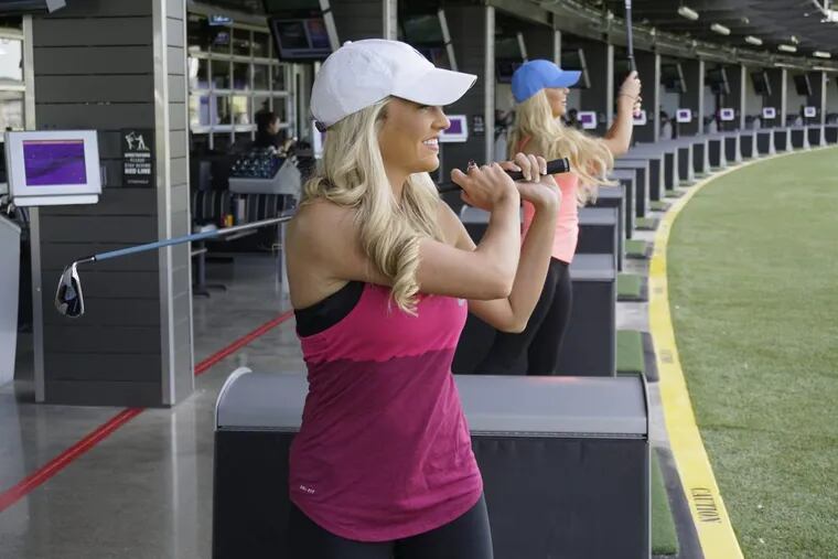 Lexie Sullivan (front) and Ashley Hancock get a sneak peak of Topgolf Fort Worth ahead of the opening of the 65,000-square-foot complex.
