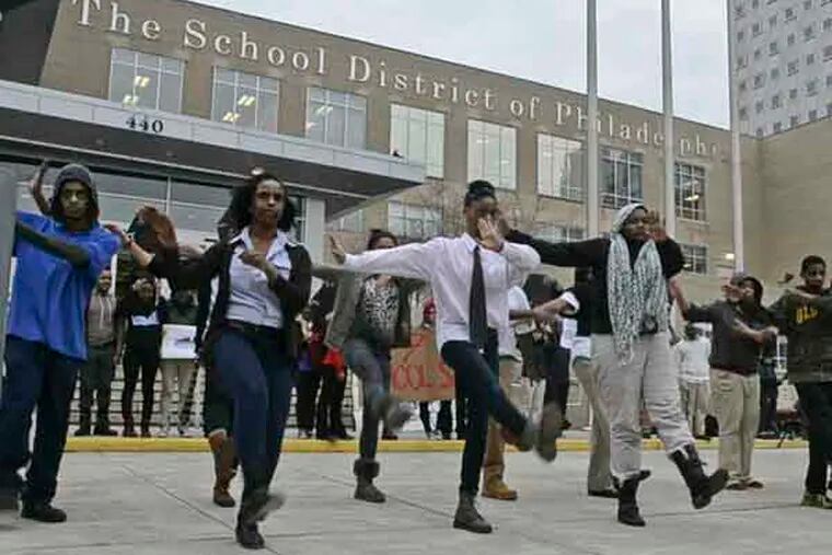 Philadelphia public school students perform the Thriller dance to protest Philadelphia School District plan to close 37 schools in front of Philadelphia School District headquarters on Broad St. January 15, 2013. ( RON TARVER / Staff Photographer )