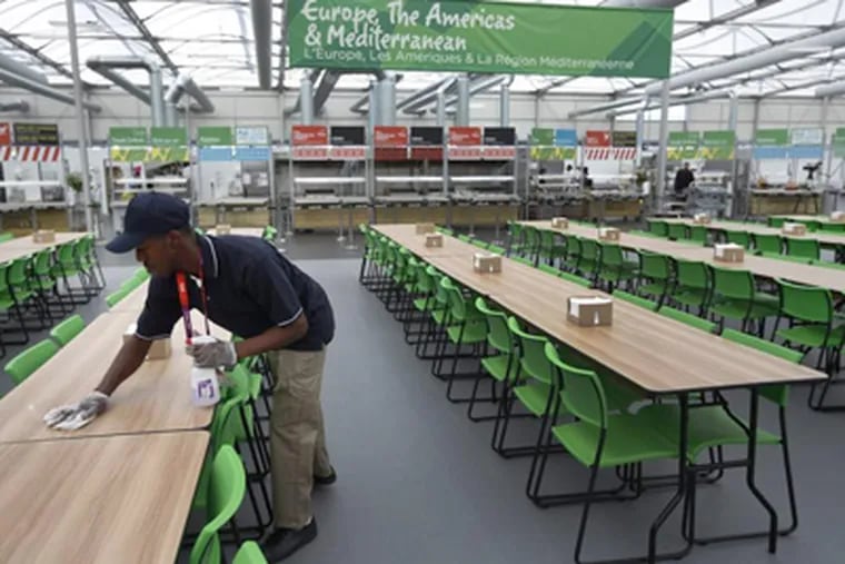 "Food hall is massive! Unbelievable! almost way 2 much choice! the strategy 2 tackle this baby is a station a day!" according to one Olympic athlete's tweet. MATT DUNHAM / Associated Press