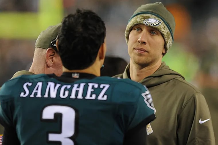 Eagles quarterbacks Mark Sanchez and Nick Foles, possibly discussing chicken fingers. (Clem Murray/Staff Photographer)