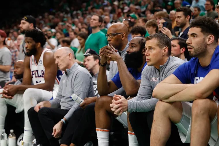 Sixers players and coaches watch the final minutes of Game 7 against the Boston Celtics during the Eastern Conference semifinal playoffs in Boston on Sunday, May 14, 2023.  The Sixers lost to the Celtics 88-112.