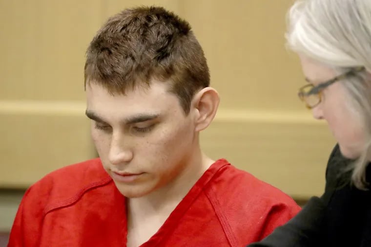 Nikolas Cruz, accused of murdering 17 people in the Florida high school shooting, appears in court for a status hearing in Fort Lauderdale, Fla. Cruz reportedly had a history of shooting small animals, among other warning signs that his behavior had the potential to turn violent.