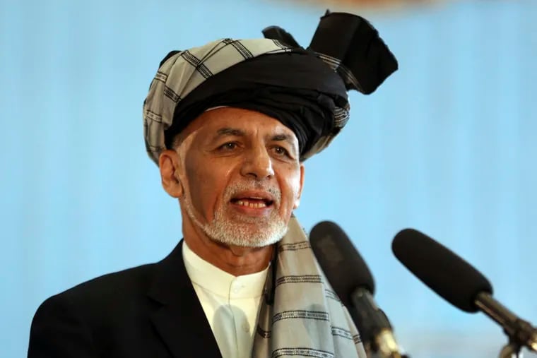 In this Sept. 28, 2019, file photo, Afghan President Ashraf Ghani speaks to journalists after voting at Amani high school, near the presidential palace in Kabul, Afghanistan. President Ghani said Tuesday, Nov. 12, his government has released three Taliban figures in effort to have the insurgents free an American and an Australian professor they abducted in 2017.