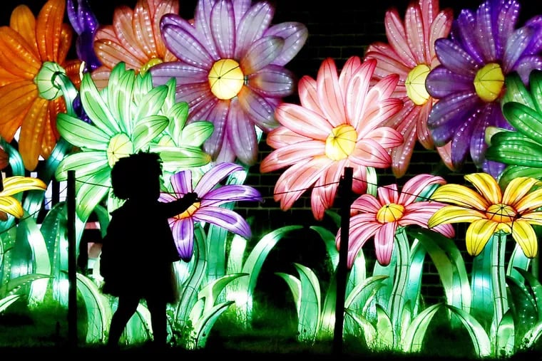 Visitors stroll around the Philadelphia Chinese Lantern Festival in Franklin Square on May 27, 2018.
