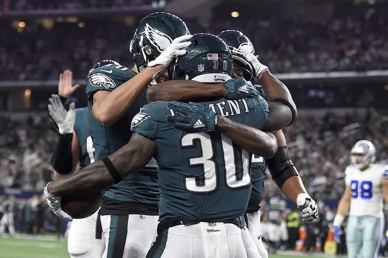 The Eagles’ Corey Clement (center) celebrates with teammates after scoring a two-point conversion vs. the Cowboys on Sunday, Nov. 19, 2017.