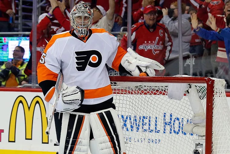 Flyers goalie Steve Mason stands in near his goal after misplaying the Capitals' Jason Chimera's goal,