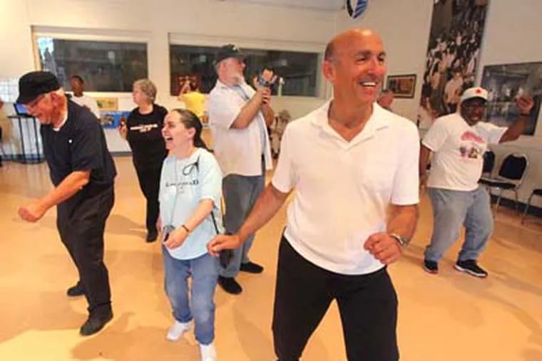 The original Bandstand Studios at 4548 Market Street were open to the public for tours, dancing. A group including Richard Dulisse, right, dance to Chubby Checker's "The Twist".  ( Charles Fox / Staff Photographer )