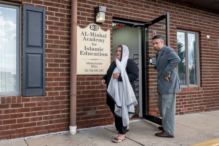 Saira Ahmed (left) and Ahsan Abdulghani (right) leave the location of their current mosque, Al-Minhal Academy. After two zoning variance denials, they will soon be opening a more spacious mosque in the same Washington Township office strip.