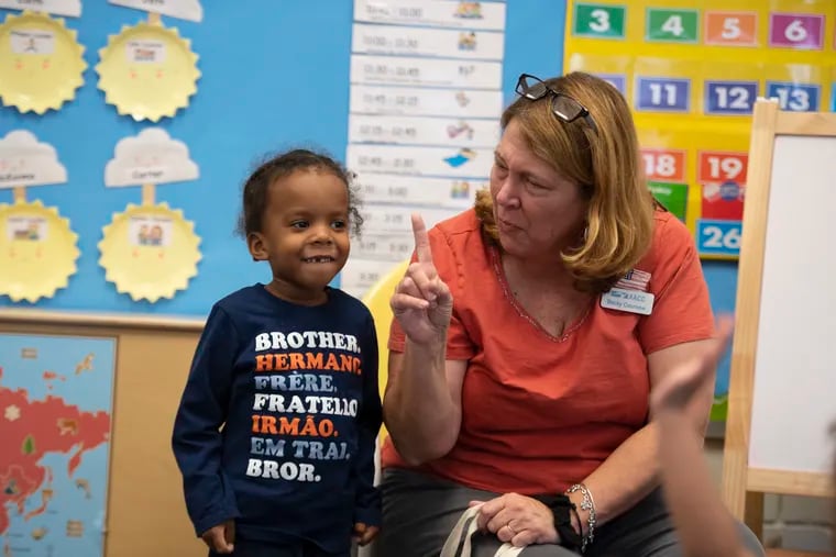 Javier Freeman, 3, and his teacher Rebecca Cournow at a child-care center at Anne Arundel Community College. Maryland is one of about 30 states where child care is more expensive than in-state tuition at public universities, according to Child Care Aware of America.