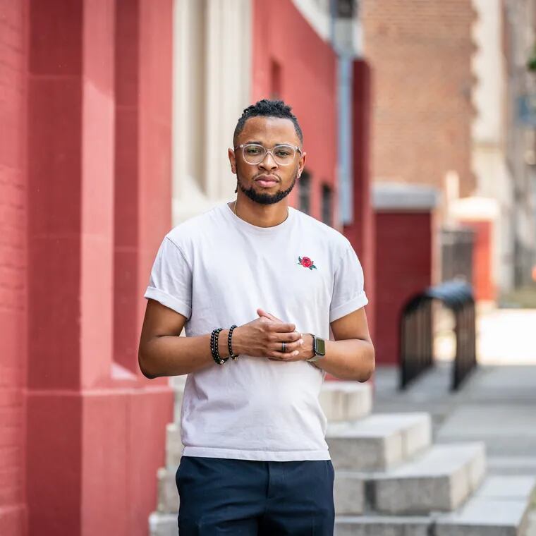 Tamir Harper, a first-year Philadelphia teacher, loves his job but says it isn't sustainable. Harper is photographed outside Lea Elementary in West Philadelphia.