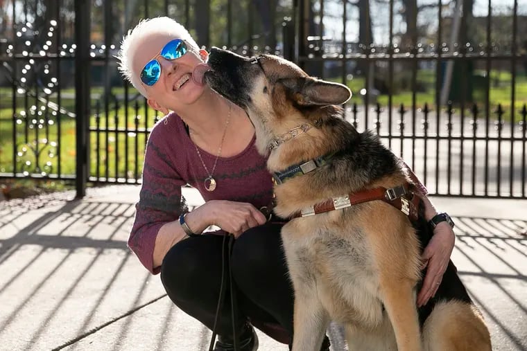 Pam McGonigle, Overbrook School for the Blind's new director of development and communications, with Maida, her guide dog and running partner.