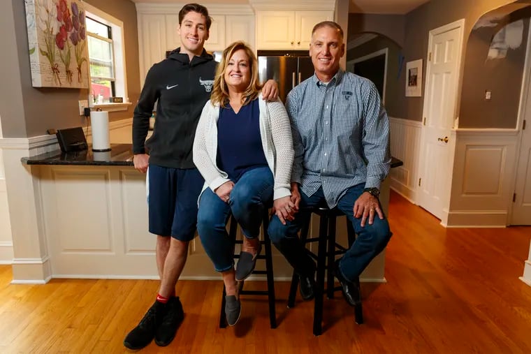 Ryan Arcidiacono (left), current Chicago Bull, with his mother, Patti, and father, Joe, at their home in Langhorne.