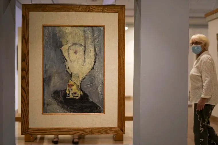 Amadeo Modigliani's 1908 "Nude with a Hat" is hung upside down because another painting by him, "Maud Abrantes," on the reverse side of the same canvas is oriented correctly, while on display at Haifa University's Hecht Museum in Haifa, Israel, in June. Curators at the museum using X-ray technology have discovered three previously unknown sketches by the celebrated 20th-century artist hiding beneath the surface of the painting.