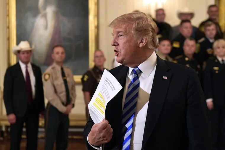 President Donald Trump responds to a reporters question during an event with sheriffs in the East Room of the White House in Washington, Wednesday, Sept. 5, 2018.
