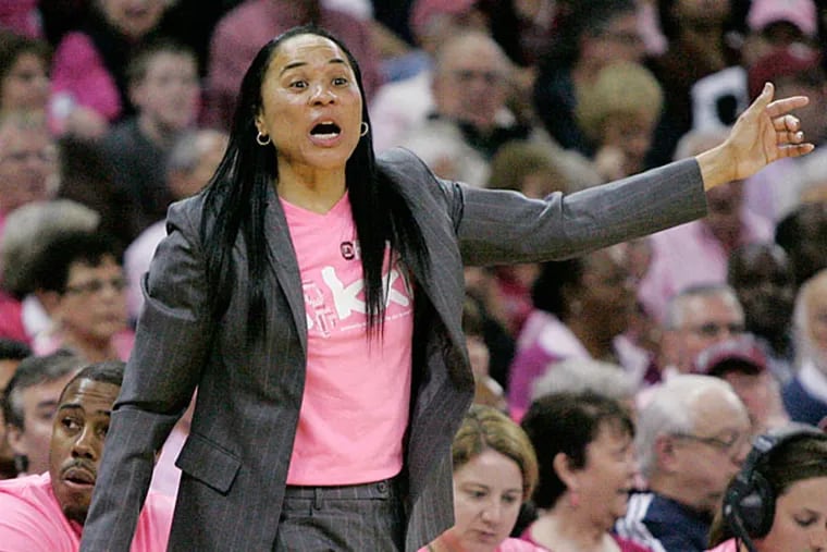 South Carolina's Dawn Staley talks to her players during the second half of their NCAA college basketball game against Florida, Sunday Feb. 23, 2014, in Columbia, SC. South Carolina defeated Florida 69-55. (Mary Ann Chastain/AP)
